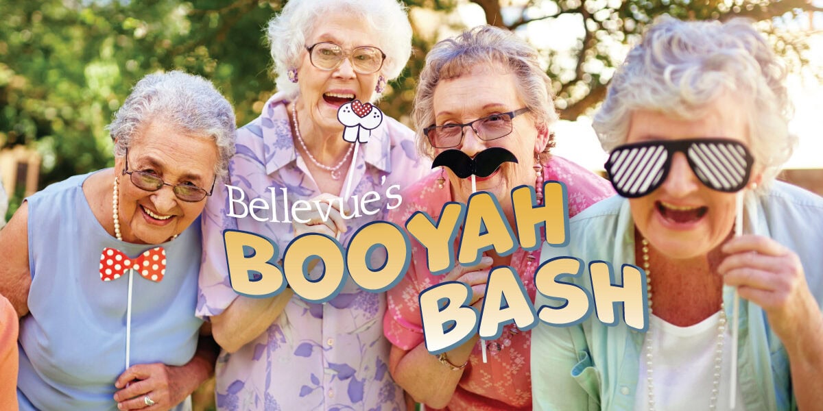 BooyahBash Senior Women with funny photo props at Bellevue Senior living